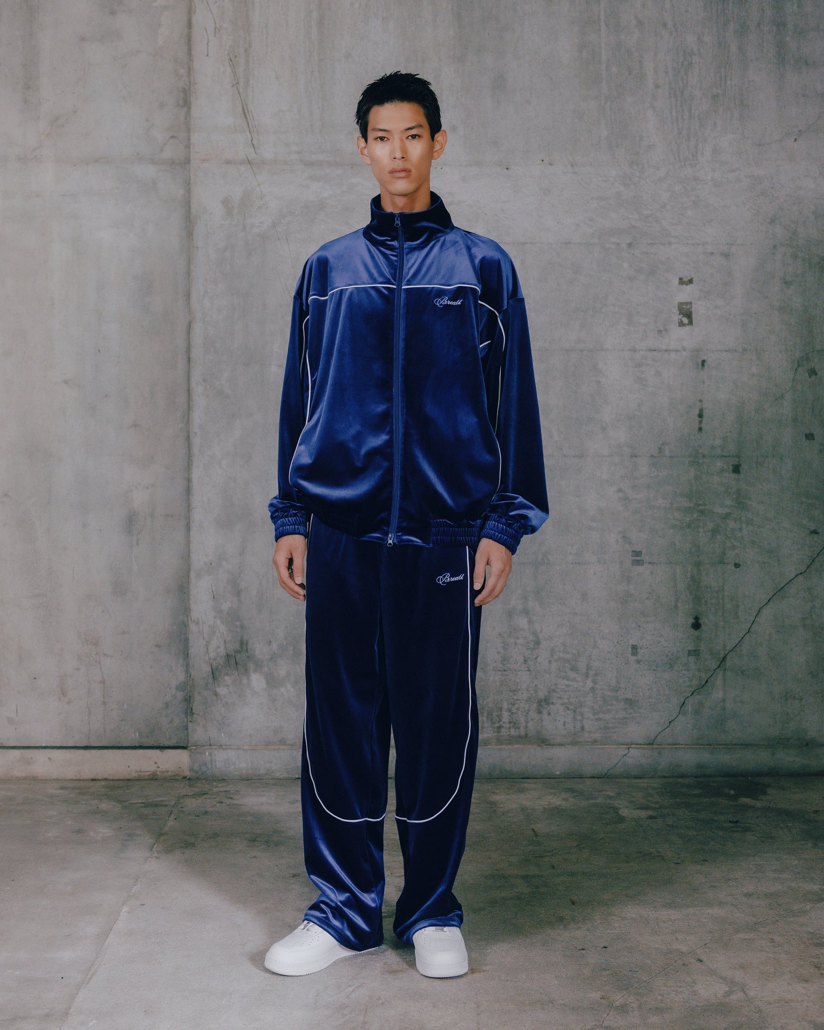 SCRIPT LOGO PIPING VELOUR TRACK PANTS / BLUE